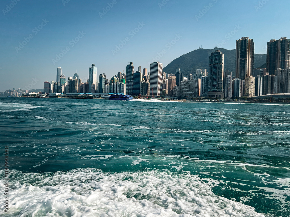 Naklejka premium Panoramic view from the sea to the city in Hong Kong. Cityscape, skyscrapers