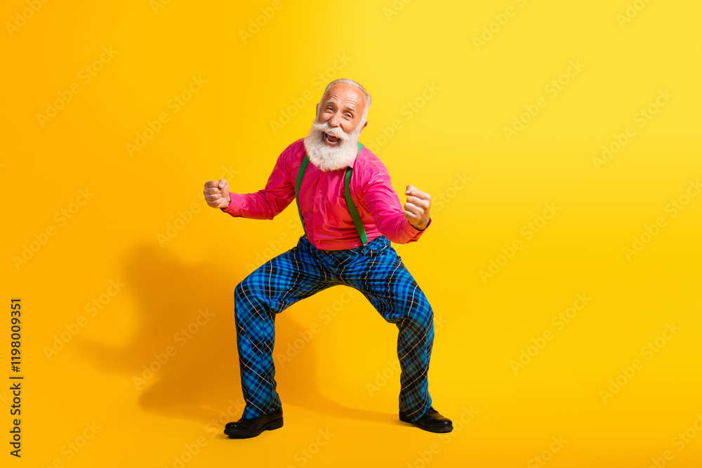 Full size photo of old gentleman excited winning dressed glamour stylish outfit party isolated vibrant yellow color background Full size photo of old gentleman excited winning dressed glamour stylish outfit party isolated vibrant yellow color background