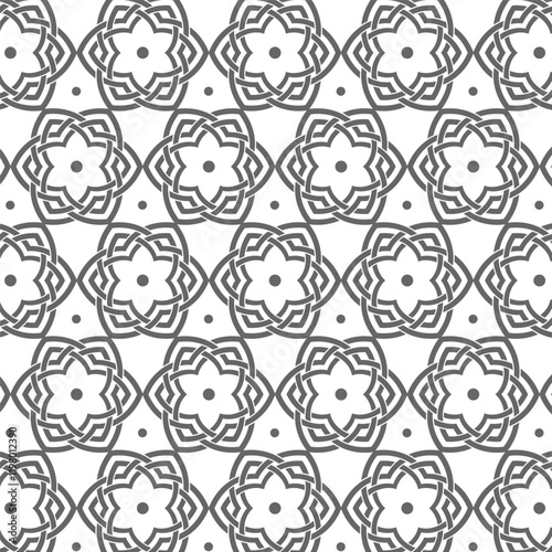 Intricate geometric floral pattern, symmetrical design, suitable for wallpaper, textile, or decoration.