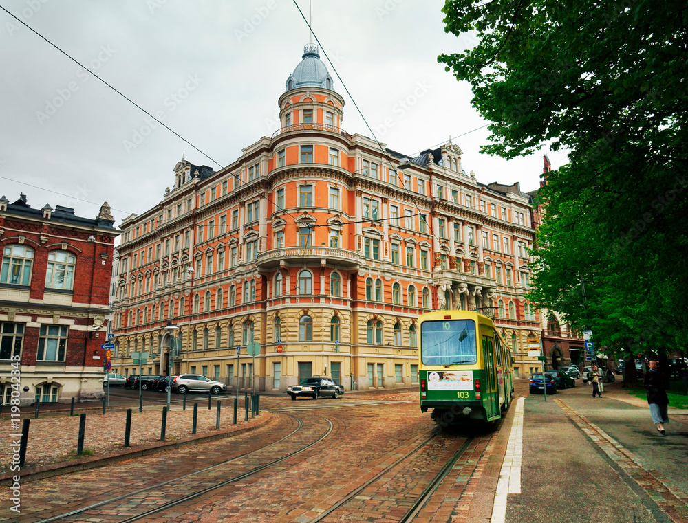 Fototapeta premium Helsinki, Finland. Tram heading down Yrjonkatu from the corner with Punanotkonkatu in the city centre