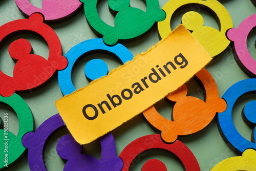 Multicolored employee figures and the word onboarding. Team integration.