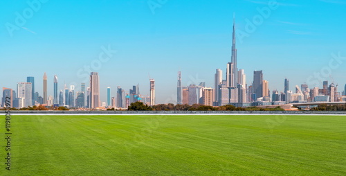  city building  skyline dubai landscape grass blue sky cityscape street travel
 photo