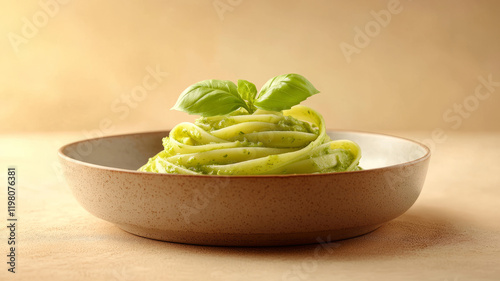 Plate of linguine with basil and green sauce. photo