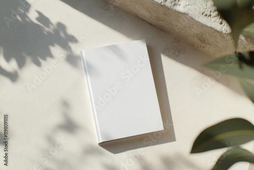 White blank hardcover book on neutral background. Top view. Mockup