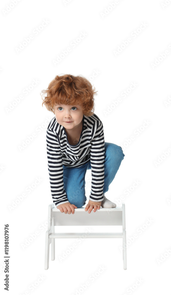 Little boy standing on step stool against white background Little boy standing on step stool against white background