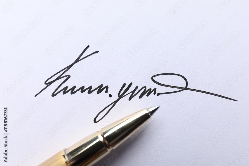 Pen and signature on white paper, closeup