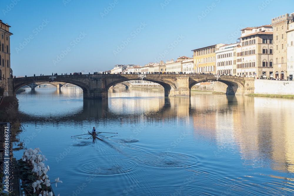 Obraz premium Rower under the bridge in Florence, Italy