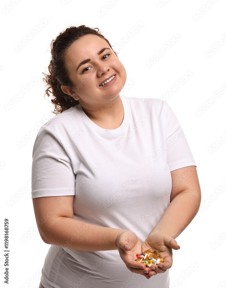 Happy plus size woman holding pile of weight loss supplements on white background Happy plus size woman holding pile of weight loss supplements on white background