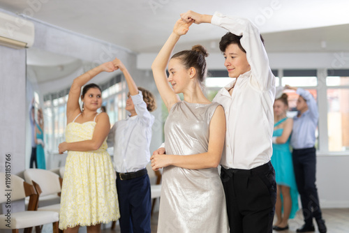 Classical dances performed by teenagers children in beautiful festive clothes photo