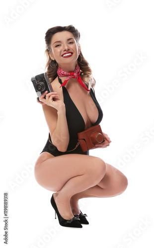 Happy pin-up woman in swimsuit with vintage camera on white background