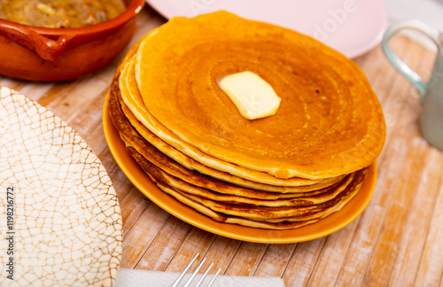 Tasty pancakes served with machanka with different types of meat and mushrooms, Belarusian dish photo