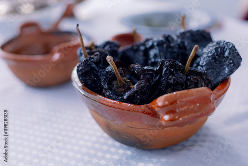 Pasilla chile in a clay pot ready to be made into mole poblano, a typical Mexican dish photo