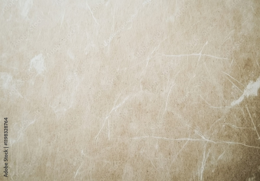 Fototapeta premium Vintage beige textured paper with stains and scratches, hyperdetailed top view.