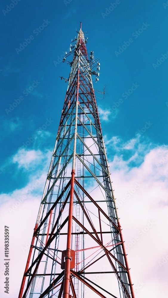 Tall radio tower in the beautiful blue sky Tall radio tower in the beautiful blue sky