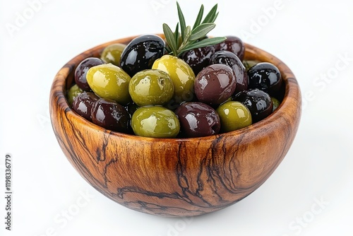 Mixed organic green and black olives with herbs in olive oil served in a wooden bowl as a snack or garnish photo