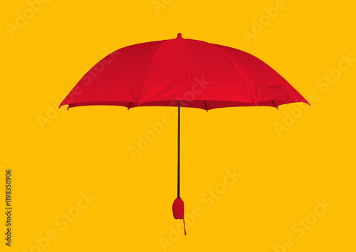 Opened yellow umbrella isolated on pastel pink studio background photo