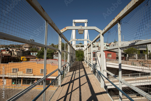 Afternoon sun shines on a bridge connecting the city center with a neighborhood in downtown Nogales, Sonora, Mexico. photo