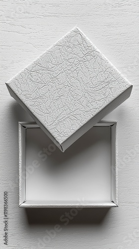 White box with a matching white lid isolated on a plain background for packaging and storage purposes