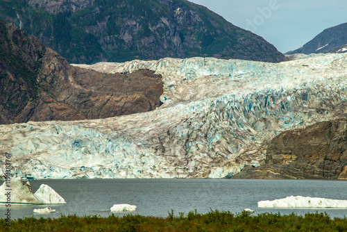 USA, Alaska, Tongass National Forest. Mendenhall Glacier at edge of lake.
