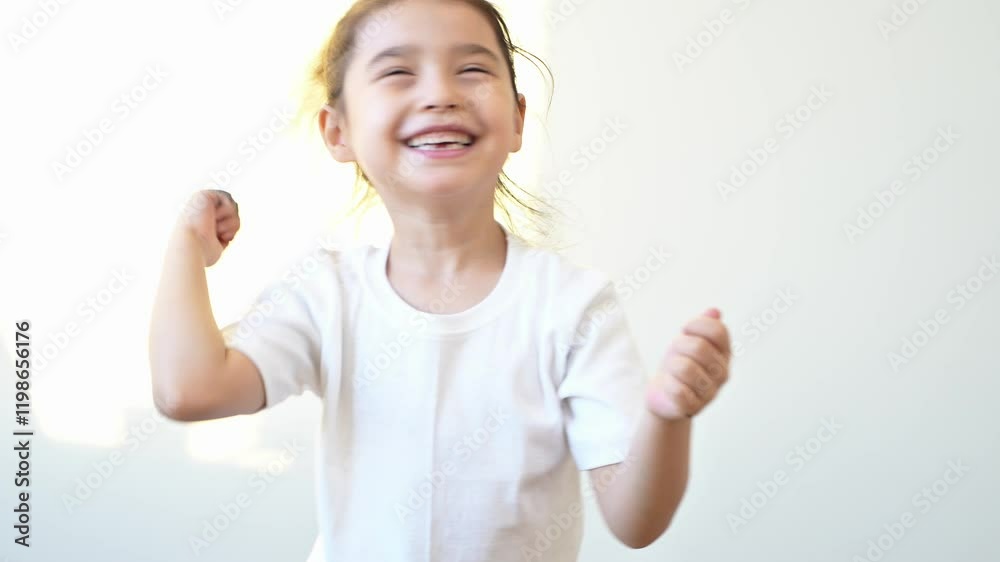 view of active awake little girl 5 years old having fun singing favorite song enjoying hobby in morning spending leisure time jumping in room. High quality 4k footage view of active awake little girl 5 years old having fun singing favorite song enjoying hobby in morning spending leisure time jumping in room. High quality 4k footage