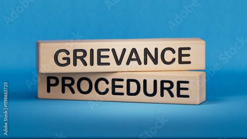 wooden cubes with text grievance procedure. Business concept. Wooden cube blocks. Copy space.3D rendering on blue background.