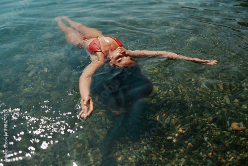 Happy woman sea relaxing floating in transparent sea water on summer holiday. Travel leisure recreation lifestyle, female in nature.