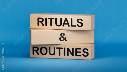 Rituals and Routines symbol. Concept words Rituals and Routines on wooden blocks.Psychological social mindfullness concept. Copy space.3D rendering on blue background.
