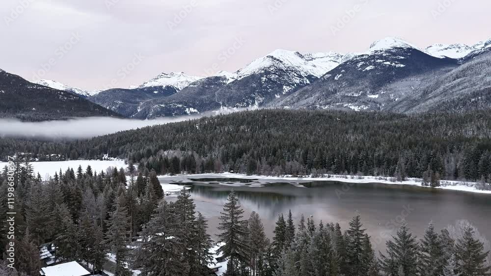 Emerald or Green lake timelapse with fog rolling thru the valley in Whistler, Canada Emerald or Green lake timelapse with fog rolling thru the valley in Whistler, Canada