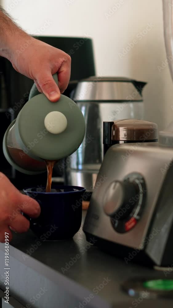 Vertical video pouring French press Fresh coffee in a blue mug in the morning Vertical video pouring French press Fresh coffee in a blue mug in the morning