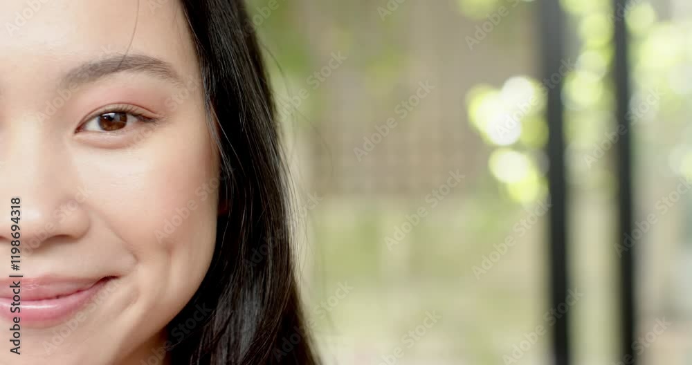Smiling woman with long hair showing dimples, close-up portrait outdoors, copy space Smiling woman with long hair showing dimples, close-up portrait outdoors, copy space
