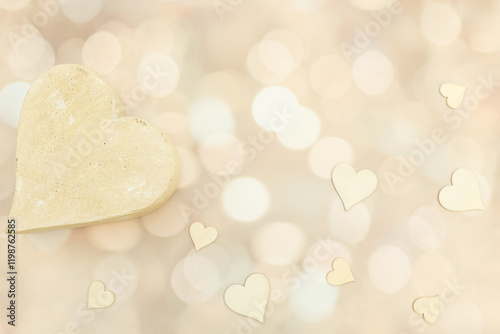 Overhead flat lay with neutral hearts on a white, cream, pink backdrop photo