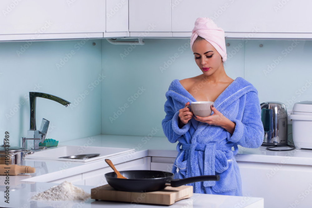 Housewife girl. Sexy woman enjoy cooking meal in modern kitchen. Sexy model making Fried egg in kitchen. Woman cooking for her lovers in her kitchen at home. Girl cooking in modern cozy kitchen. Housewife girl. Sexy woman enjoy cooking meal in modern kitchen. Sexy model making Fried egg in kitchen. Woman cooking for her lovers in her kitchen at home. Girl cooking in modern cozy kitchen.