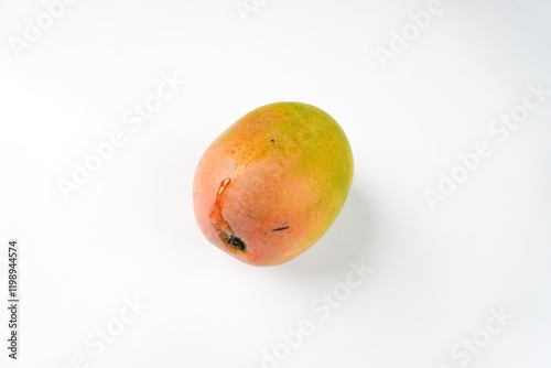 Gedong gincu mango with orange, yellow and green color gradations isolated on white background photo