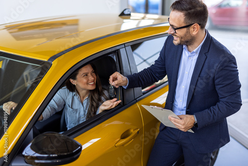 Car Renting Service. Young Woman Driver Taking Keys From Manager While Sitting In Rental Auto, Smiling woman Enjoying Vehicle Leasing, Cropped Image, Closeup