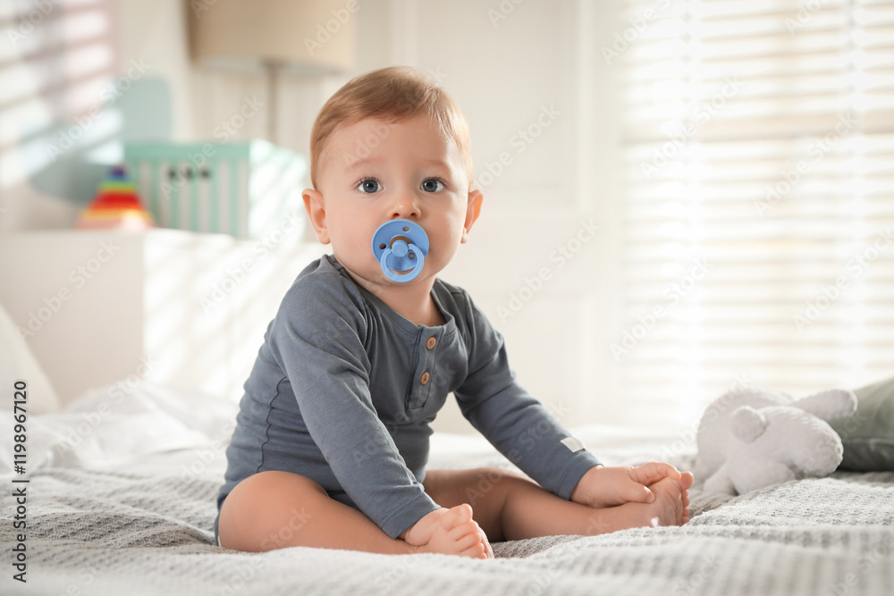 Fototapeta premium Cute little baby on bed at home