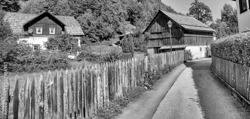 Wallpaper Mural Picturesque view of Hallstatt city and lake, surrounded by stunning alpine mountains and serene waters Torontodigital.ca