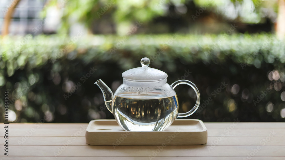 plain hot water: A Zen-inspired image featuring a clear glass teapot filled with plain hot water, placed on a light wooden tray plain hot water: A Zen-inspired image featuring a clear glass teapot filled with plain hot water, placed on a light wooden tray