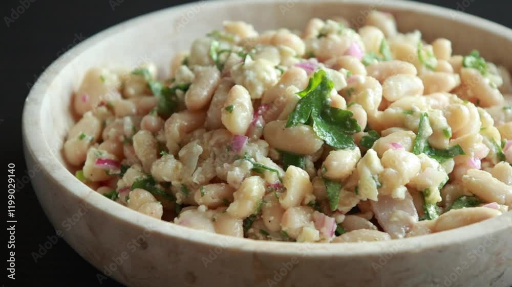 White Bean Salad in a Bowl with Feta and Red Onion Close-Up White Bean Salad in a Bowl with Feta and Red Onion Close-Up