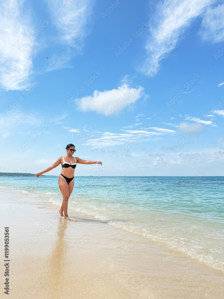 Tourist walking on tropical beach enjoying summer vacation Tourist walking on tropical beach enjoying summer vacation