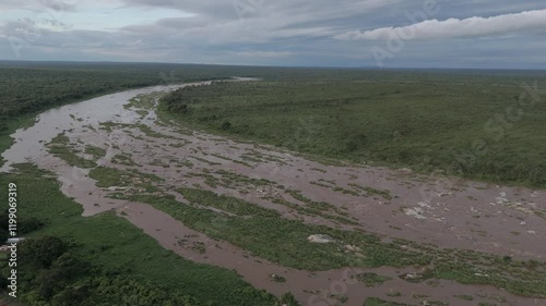Wallpaper Mural Cinematic aerial downward tilt of a flowing seasonal river that's flooding after heavy rains during summer in the low veld, Kruger National Park. Torontodigital.ca