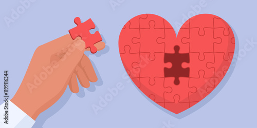 Man completing a puzzle shaped as heart