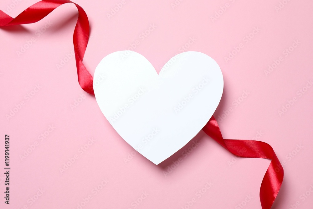 Beautiful paper heart with red silk ribbon on pink background Beautiful paper heart with red silk ribbon on pink background