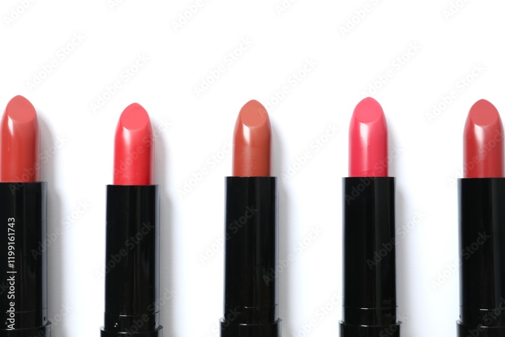 Obraz premium Multi-colored lipsticks isolated on a white background