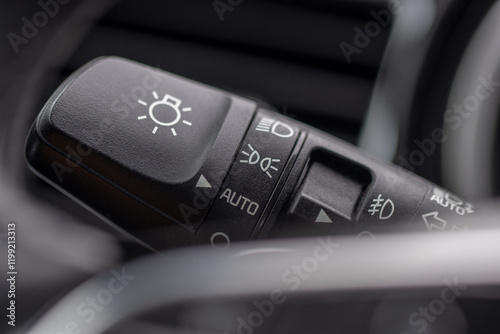 The light switch panel on a passenger car dashboard. photo