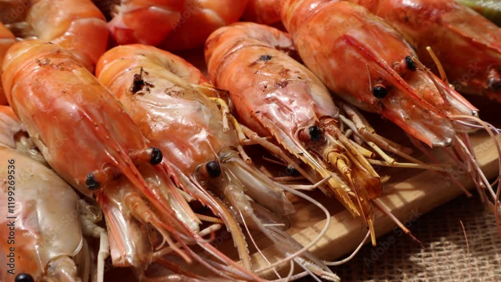 Side View. grilled shrimp on a wooden plate and side dish Seafood dipping sauce. Types of grilled seafood Side View. grilled shrimp on a wooden plate and side dish Seafood dipping sauce. Types of grilled seafood