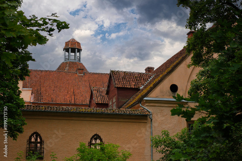 Castle tower with blue skies in the background. Medieval castle in Europe in summer.