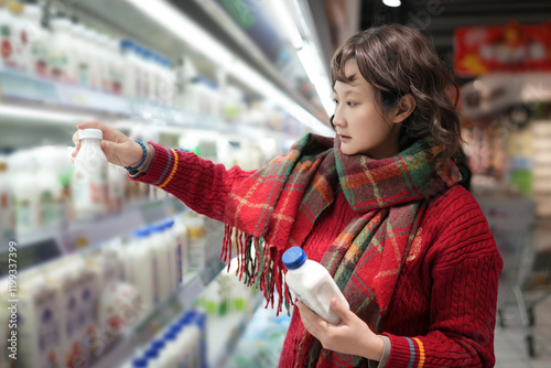 Canvas Print Woman Choosing Dairy Products in a Supermarket Setting
