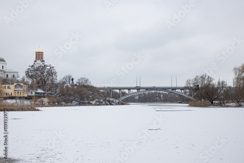 Beautiful colored houses next to a frozen river