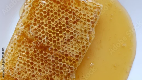 honey flowing over natural honeycomb