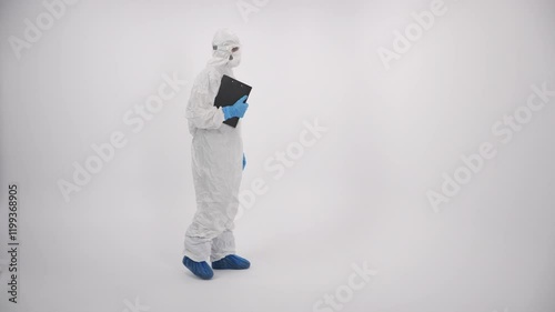 A scientist in PPE entering and verifying a medical record on a white background